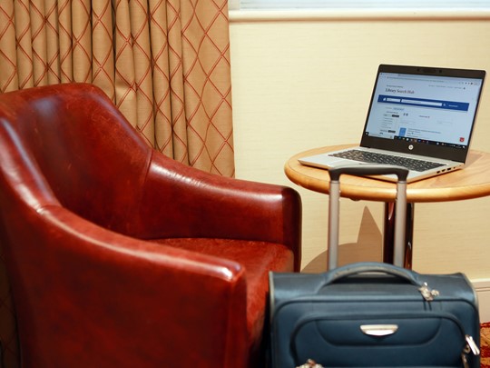 Chair laptop and suitcase